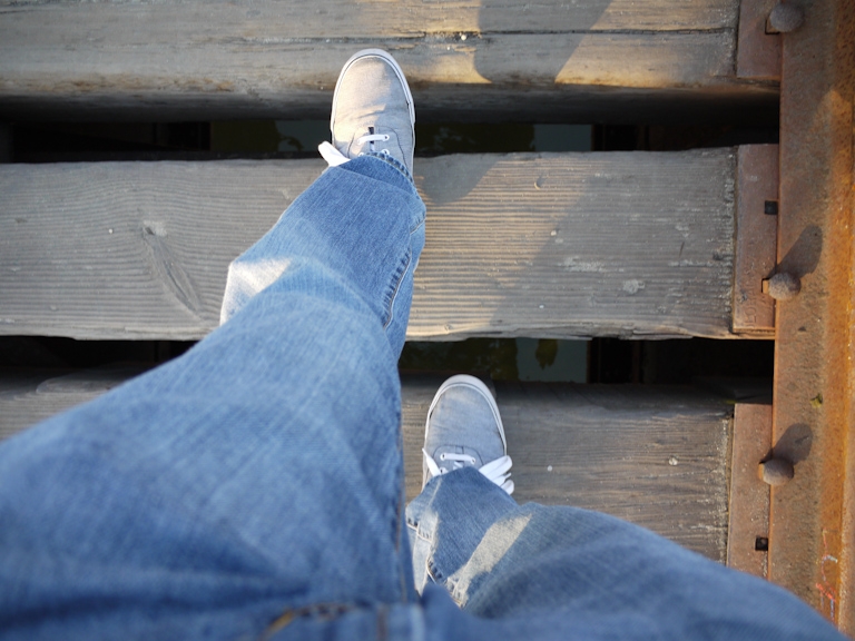 walking on train tracks bridge